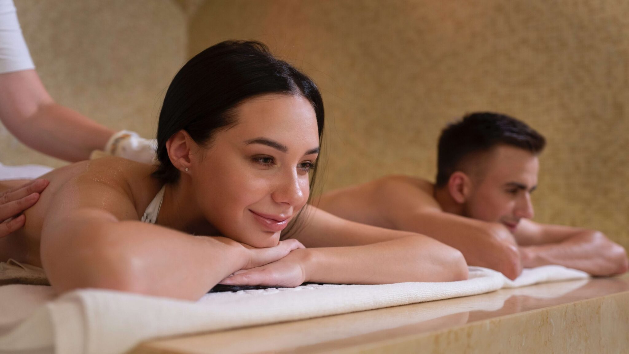 An image of a couple enjoying the benefits of a couples massage with Dark Massage.